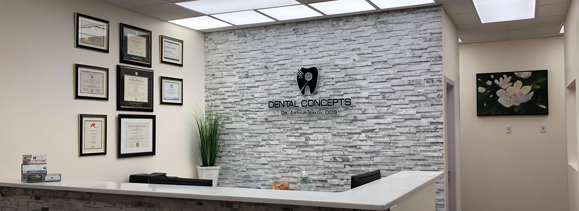 The image displays an interior office space with a modern design featuring a brick wall, framed pictures on the wall, a reception desk, and a sign with text that reads 1234 .